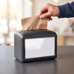 2-Ply Kraft Dispenser Napkin coming out of dispenser