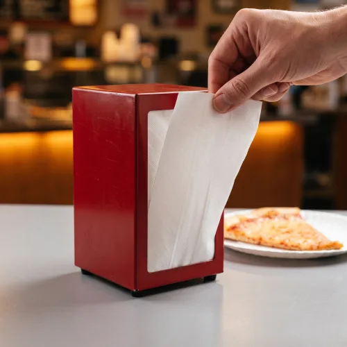 White 1-Ply Tall Fold Napkin 6.5" x 13" coming out of dispenser